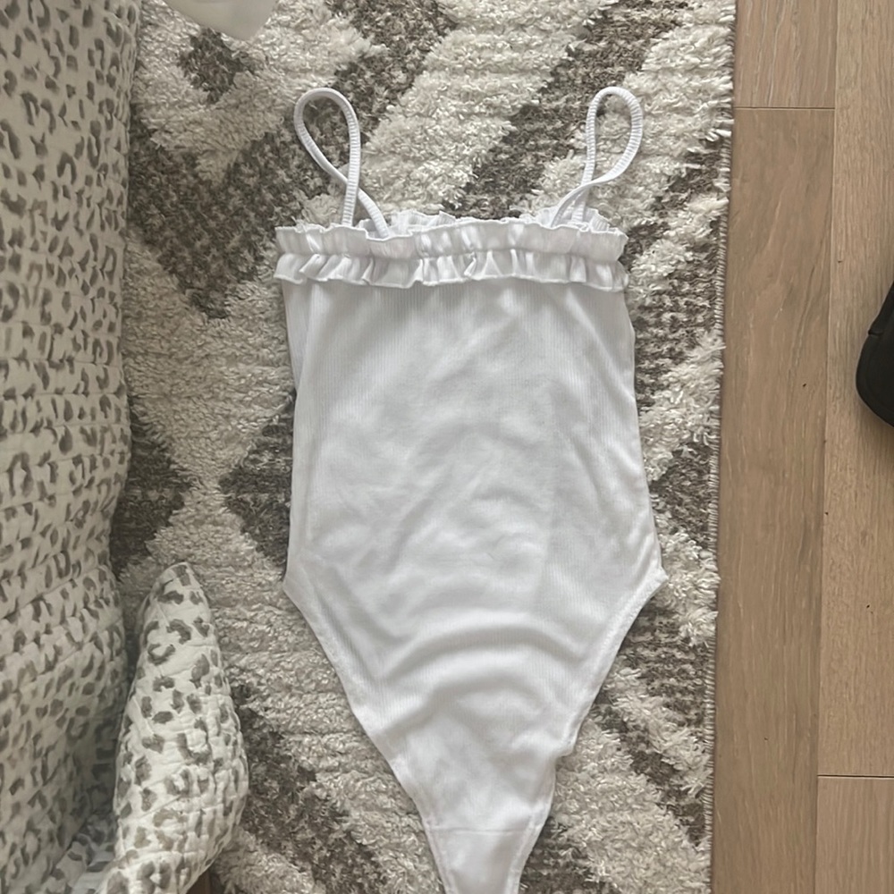 White ruffle body suit